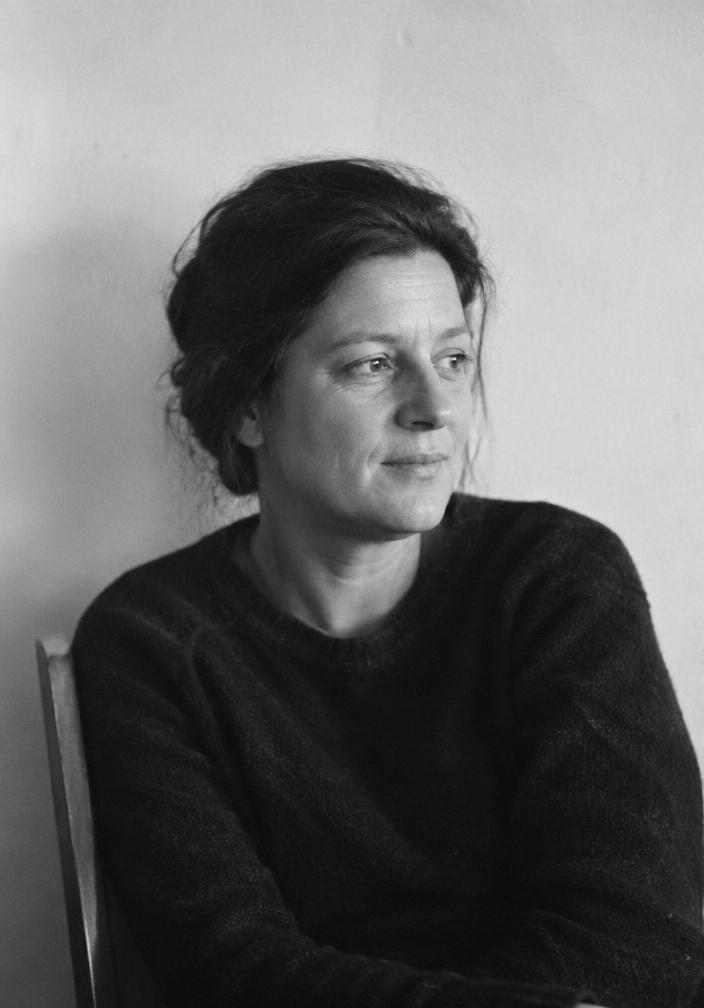 Candid black and white portrait of a middle-aged woman looking away